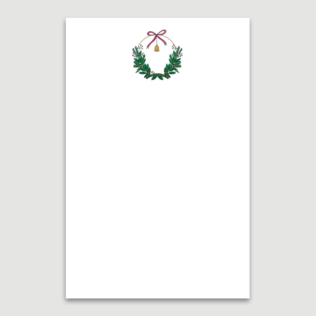 Keep track of holiday to-do's and memos with this notepad featuring a beautiful bell wreath header.